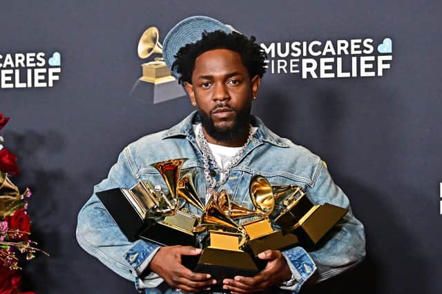 Kendrick Lamar poses with the Record Of The Year, Best Rap Performance, Song Of The Year, Best Music Video, Best Rap Song awards in the press room during the 67th Annual Grammy Awards.