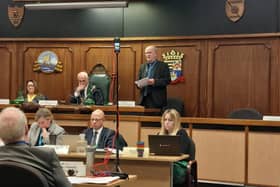 Gosport Borough Council leader Peter Chegwyn (standing) has hit out at the government's reorganisation plans which could see his authority abolished