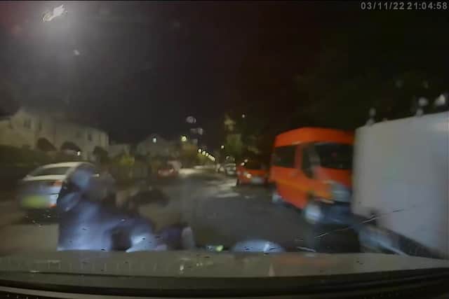 Screen grab from handout video dated 03/11/22 which has been played to the jury showing the moment a marked police car driven by former Pc Tim Bradshaw knocks the rider and pillion passenger off an electric motorbike in Hawthorn Road, Bognor Regis, on November 3, 2022. 

Photo credit should read: Court Handout/PA Wire