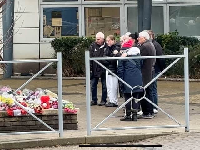Harvey Willgoose's family stood in quiet reflection outside All Saints Catholic High School - exactly one week after his sad death.