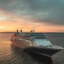Borealis at sea at sunset