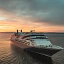 Borealis at sea at sunset