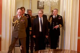 British prime minister Keir Starmer is expected to summon defence chiefs amid squabbling over how much the UK should be spending on the armed forces. Pictured is the prime minister alongside General Sir Roly Walker KCB DSO (L) and Chief of the Defence Staff (CDS) Admiral Sir Tony Radakin on November 26, 2024 in London.