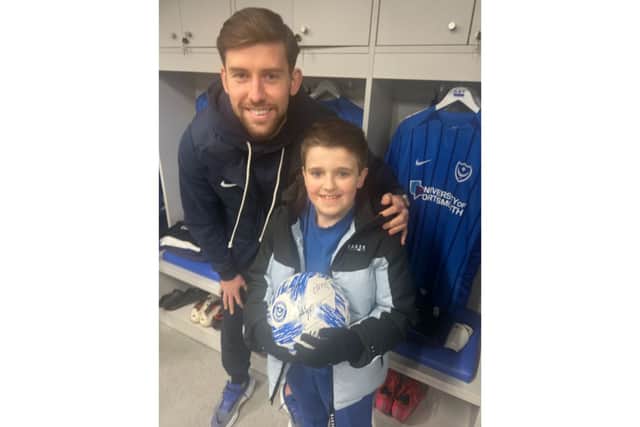 Dempsey Smith, 9, walked onto the Fratton Park pitch with Callum Lang on Tuesday nights 2-1 win over Cardiff.