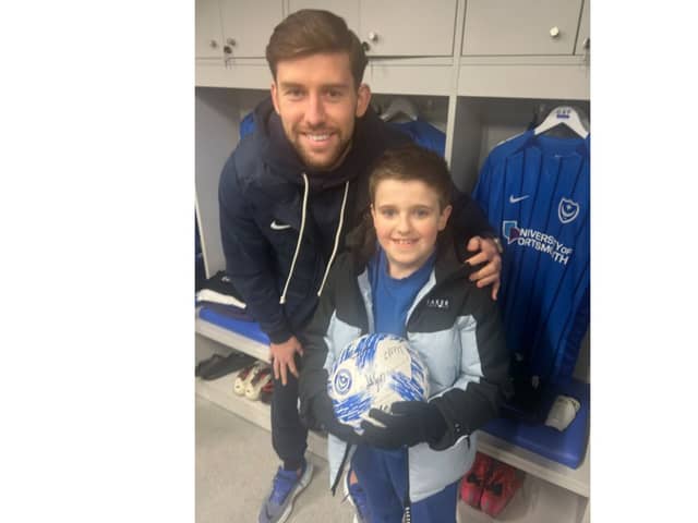 Dempsey Smith, 9, walked onto the Fratton Park pitch with Callum Lang on Tuesday nights 2-1 win over Cardiff.
