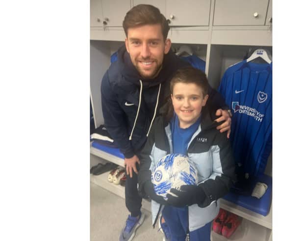 Dempsey Smith, 9, walked onto the Fratton Park pitch with Callum Lang on Tuesday nights 2-1 win over Cardiff.