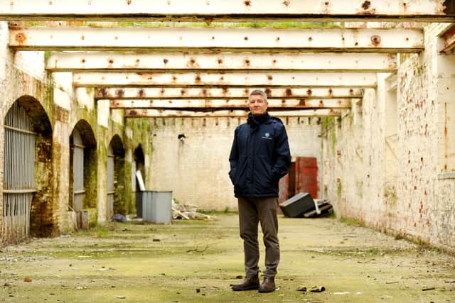 The old Royal Navy Rum Store, a 150-year-old Grade II listed building at Victoria Quay in Gosport, is due to be transformed into a mixed-use development with businesses  and a terrace rooftop bar. Pictured is: Ben Mason, portfolio manager for UK Docks Marine Services.