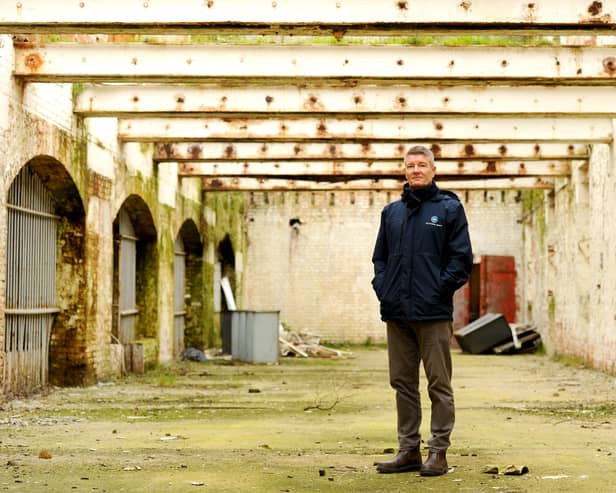 The old Royal Navy Rum Store, a 150-year-old Grade II listed building at Victoria Quay in Gosport, is due to be transformed into a mixed-use development with businesses  and a terrace rooftop bar. Pictured is: Ben Mason, portfolio manager for UK Docks Marine Services.