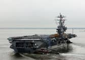 A fighter jet fell off the side of the American aircraft carrier USS Harry S. Truman while she was deployed in the Red Sea.
