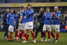 Pompey's Hayden Matthews, centre,  applauds the travelling Fratton faithful following victory at Oxford United