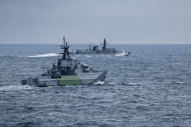 HMS Iron Duke and HMS Tyne making their approach on a Russian warship.