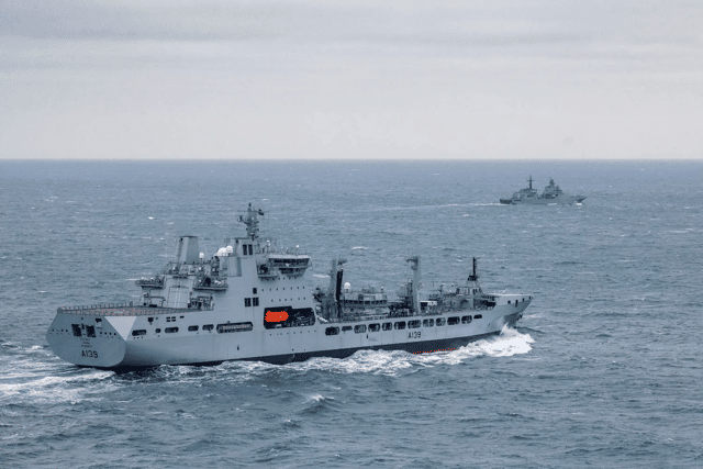 RFA Tideforce provided support for American forces that seized a Russian flagged oil tanker. Pictured is the auxiliary ship escorting Russian warship Ivan Gren in February 2025