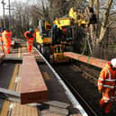 Giant pieces of Japanese-made artificial wood are craned into place, to sit beneath the new steel rails. It is part of major works on the upper railway lines at Portsmouth & Southsea station during February half-term
Picture: Chris Moorhouse (180225-25)