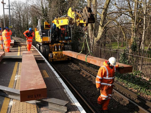 Giant pieces of Japanese-made artificial wood are craned into place, to sit beneath the new steel rails. It is part of major works on the upper railway lines at Portsmouth & Southsea station during February half-term
Picture: Chris Moorhouse (180225-25)