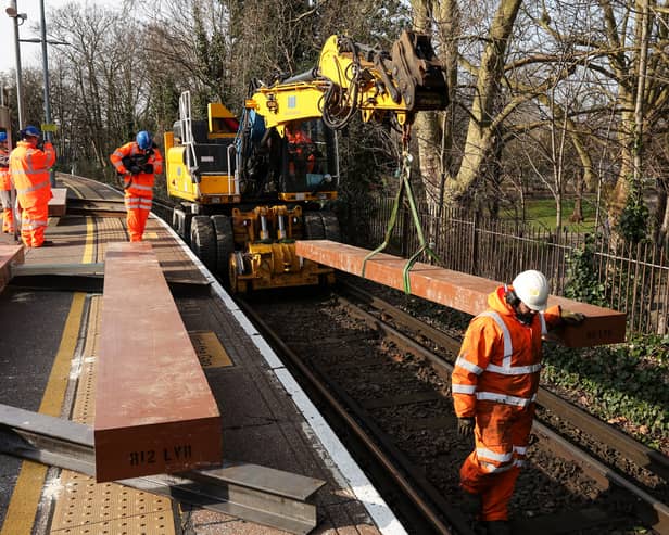 Giant pieces of Japanese-made artificial wood are craned into place, to sit beneath the new steel rails. It is part of major works on the upper railway lines at Portsmouth & Southsea station during February half-term
Picture: Chris Moorhouse (180225-25)