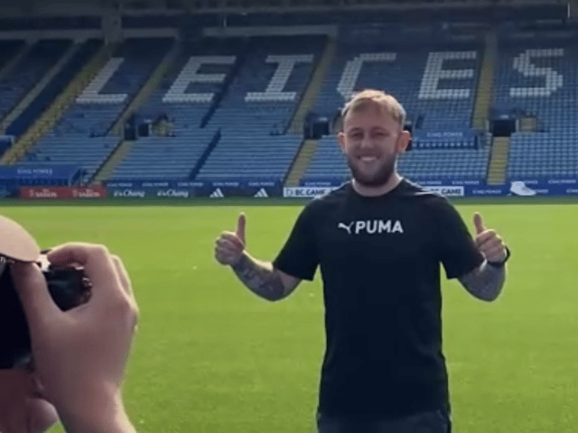 Photo of Matthew getting his photo taken in a Premier League football stadium