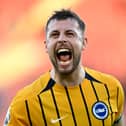 Brighton's former Pompey favourite, Adam Webster, celebrates captaining his side to victory over Southampton. Pic: Getty Images