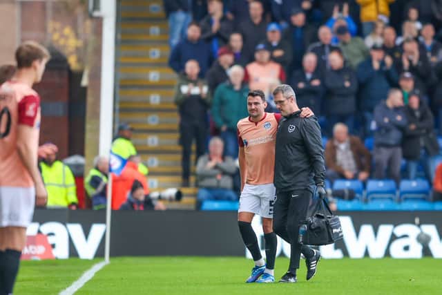 Regan Poole after injuring his knee against Chesterfield last November. Pic: Simon Davies/ProSportsImages