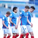 Charlie Daniels, centre, is currently in charge of Watford's under-21s