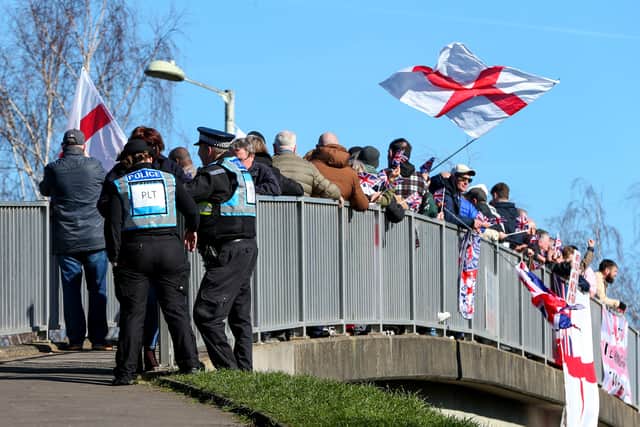 Protesters on the footbridge over Wallington Way