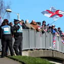 Protesters on the footbridge over Wallington Way