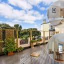 This home comes with seven bedrooms, three bathrooms and two reception rooms.