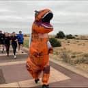 Arnie Delstanche is taking on a marathon in Norway in June for Cancer Research UK - dressed as a T-Rex