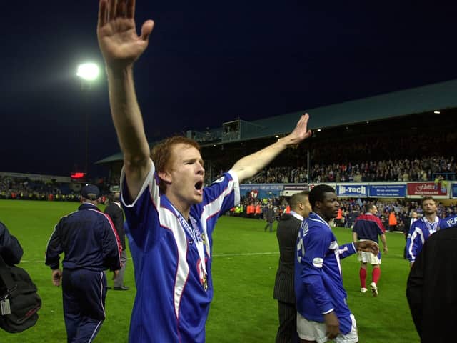 Former Pompey defender Hayden Foxe celebrates his side's Division One title win in 2003.