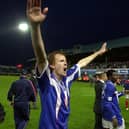 Former Pompey defender Hayden Foxe celebrates his side's Division One title win in 2003.