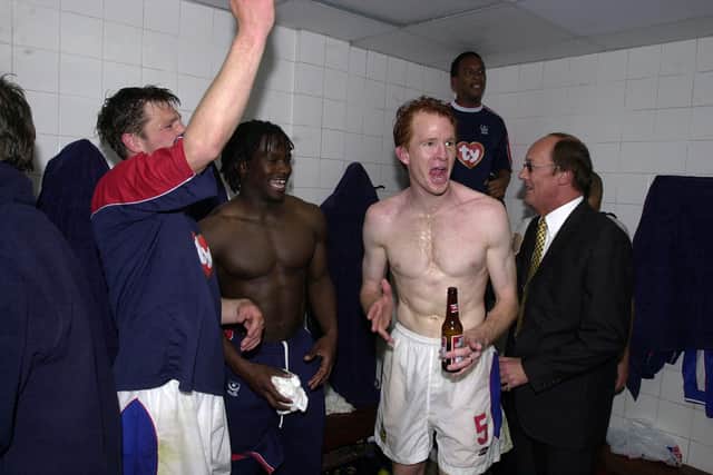 Former Pompey defender Hayden Foxe celebrates his side's Division One title win in 2003.