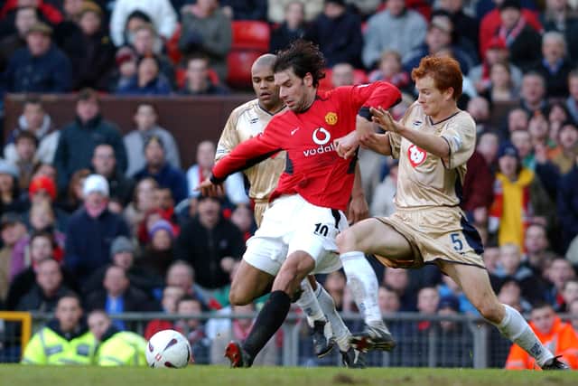 Pompey's Hayden Foxe tackles Manchester United's Ruud Van Nistelrooy at Old Trafford in 2003. Pic: Getty.