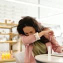 Hay fever symptoms include sneezing, a runny nose and itchy eyes.