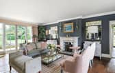 The listing says: "Built in the Georgian style in the 1960s, with more recent additions, the house is classically proportioned with light rooms, large sash windows and high ceilings." 
