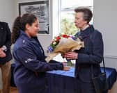 Pictured: HRH being presented with a posy of flowers by Miss Arrielle Deane, young crew member from the Royal Navy Sailing Association in Gosport.