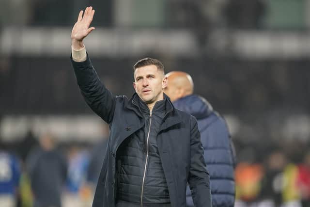 John Mousinho salutes the Pompey fans after the Blues' 4-0 defeat at Derby back in December