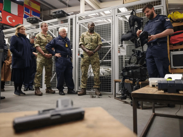 Adventurer Bear Grylls, former Portsmouth North MP Penny Mordaunt and other guests were given a tour of a Royal Navy base on Horsea Island - showcasing divers and their sophisticated equipment.