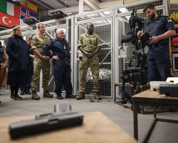 Adventurer Bear Grylls, former Portsmouth North MP Penny Mordaunt and other guests were given a tour of a Royal Navy base on Horsea Island - showcasing divers and their sophisticated equipment.