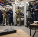 Adventurer Bear Grylls, former Portsmouth North MP Penny Mordaunt and other guests were given a tour of a Royal Navy base on Horsea Island - showcasing divers and their sophisticated equipment.