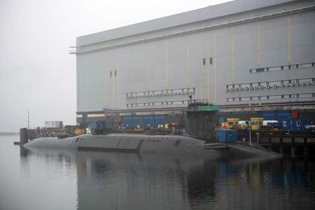 New Dreadnaught-class nuclear submarines are being built for the Royal Navy at a cost of £41bn, with a date being given as to when they'll enter the fleet. Pictured is a  Vanguard-class submarine undergoing maintenance at HM Naval Base Clyde at Faslane, north-west of Glasgow, Scotland.