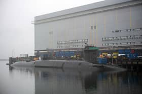 New Dreadnaught-class nuclear submarines are being built for the Royal Navy at a cost of £41bn, with a date being given as to when they'll enter the fleet. Pictured is a  Vanguard-class submarine undergoing maintenance at HM Naval Base Clyde at Faslane, north-west of Glasgow, Scotland.