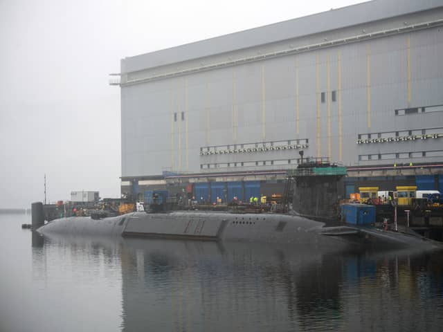 New Dreadnaught-class nuclear submarines are being built for the Royal Navy at a cost of £41bn, with a date being given as to when they'll enter the fleet. Pictured is a  Vanguard-class submarine undergoing maintenance at HM Naval Base Clyde at Faslane, north-west of Glasgow, Scotland.