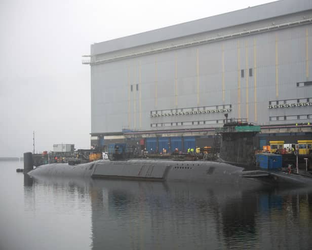 New Dreadnaught-class nuclear submarines are being built for the Royal Navy at a cost of £41bn, with a date being given as to when they'll enter the fleet. Pictured is a  Vanguard-class submarine undergoing maintenance at HM Naval Base Clyde at Faslane, north-west of Glasgow, Scotland.