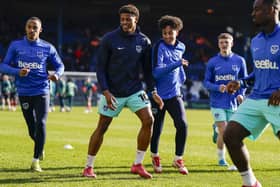 Kusini Yengi warms up ahead of Pompey's recent game against Luton at Kenilworth Road
