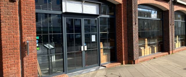 Signs for Salt & Sage Bistro have appeared at the former site of Three Joes