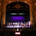 Visitors tour the theatre