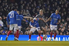 Pompey players press Cardiff's Ruben Colwill last month - but just how 'relentless' in their work compared to Championship rivals?