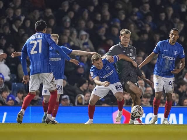 Pompey players press Cardiff's Ruben Colwill last month - but just how 'relentless' in their work compared to Championship rivals?