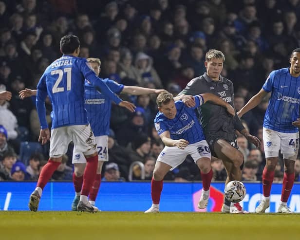 Pompey players press Cardiff's Ruben Colwill last month - but just how 'relentless' in their work compared to Championship rivals?