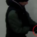 Man with combat knife walks through city centre.