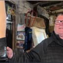 Shop owner holding an artificial leg